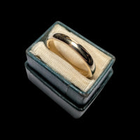The Vintage Vault 10K yellow gold D profile polished wedding band in a vintage ring box