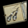 The Vintage Vault vintage sterling silver earrings with polished etched Northwest Pacific Native American designs.