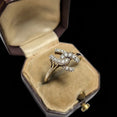 The Vintage Vault 10K two-tone yellow and white gold interlocking horseshoe diamond ring in a velvet jewelry box.